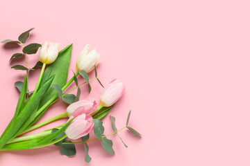 Beautiful tulips with eucalyptus on pink background. International Women's Day