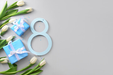 Figure 8 with gift boxes and beautiful tulips on grey background. International Women's Day
