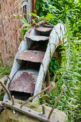 Abandoned Rustic Gutter Overrun by Nature, Urban Decay Scene