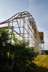 Abandoned Roller Coaster Amidst Overgrowth, Ground Up View