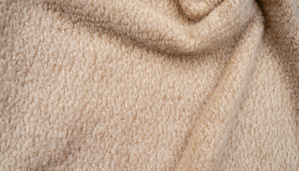 Fototapeta na wymiar Beige coat fabric, alpaca. Texture of warm wool fabric. Winter clothes. Natural wool, beige wool pile fabric.