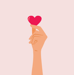 Hand Holding a Heart Love Concept Design Illustration. Person showing gratitude and heartfelt sentimental feelings 
