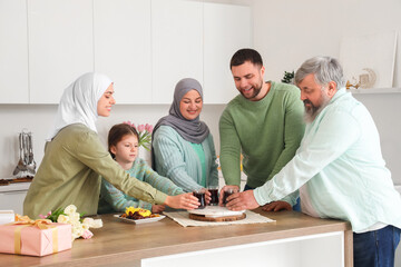 Happy Muslim family with tea in kitchen. Ramadan celebration