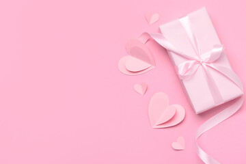 Composition with gift box and paper hearts for Valentine's Day celebration on pink background - obrazy, fototapety, plakaty
