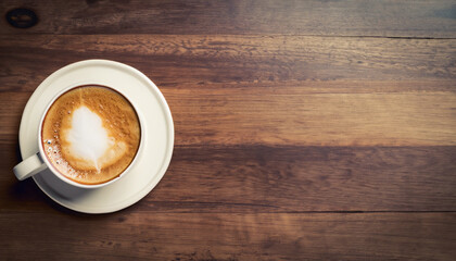 Coffee cup top view on dark wood table background with copy space; old retro vintage style image