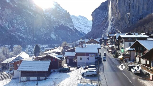 Lifting Above Snow Covered Homes In Village | Lauterbrunnen Switzerland, Swiss Valley in Alps Drone, Europe, 4K