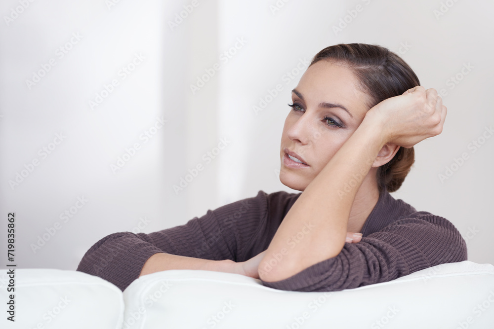 Poster Thinking, relax and calm woman on a sofa with memory, remember or nostalgia in her home. Peaceful, face and female person chilling in a living room on weekend, vacation or day off for daydreaming