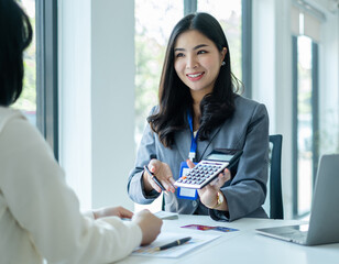 Asian business customer service representatives work and smile serve sell credit card to customers....