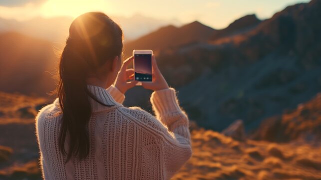 Anonymous female traveler in casual sweater taking picture of amazing landscape with mountains and sunset sky on smartphone during vacation in Almatret : Generative AI
