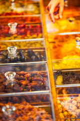 a variety of traditional Chinese medicines displayed in transparent boxes