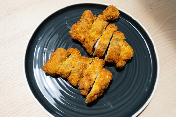 A plate of two chicken katsu.