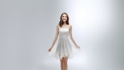 Naklejka premium Fashion-forward full-body portrait showcases beautiful woman in enchanting long white dress, smooth fabric, radiating sophistication on modern white gray setting. Generative AI.