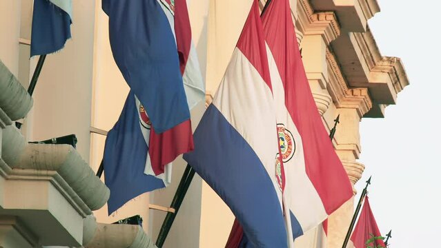 Flags of Paraguay at The Cabildo Museum, Former Parliament Building, Now a Cultural Centre in Historic Downtown, Asuncion, Paraguay. 4K Resolution.