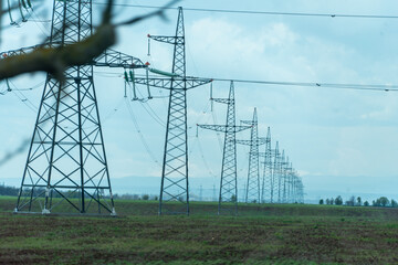 High voltage towers with sky background. Power line support with wires for electricity...
