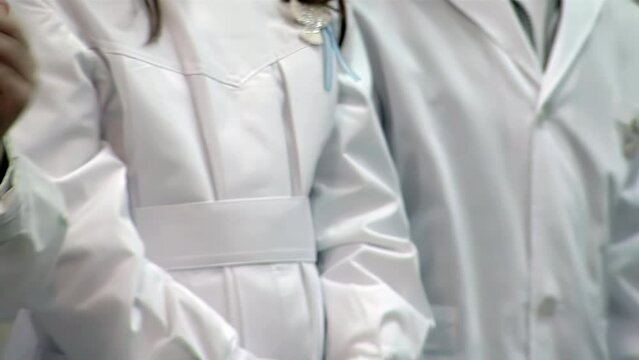 School Children Applauding During the Flag Ceremony in a Public School in Argentina. Close Up. 4K Resolution.