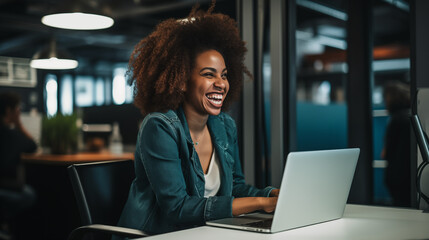 Happiness in the office as an African American businesswoman smiles while engrossed in her work at her desk - obrazy, fototapety, plakaty