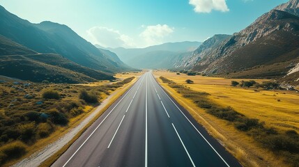 An empty mountain highway on a sunny day, bird eye view