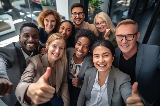 group of professional work friends taking a picture at modern workplace 