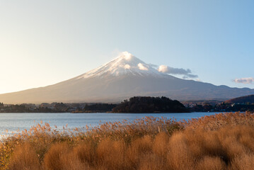 Mount Fuji, the iconic symbol of Japan, during the season of autumn foliage, a period of...