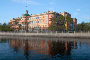 Fototapeta na wymiar View of the ancient Engineer's Castle from the embankment of the Fontanka river on a sunny May morning. Saint-Petersburg, Russia