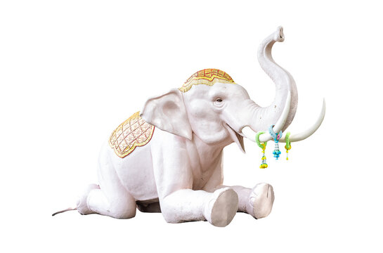 Picture of a white elephant statue Lying down on a stone pedestal and is raising its trunk upwards On both sides of the tusks were decorated 3 bunches of garlands.