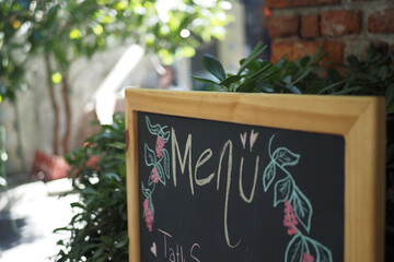 Cafe menu on black board outdoor 