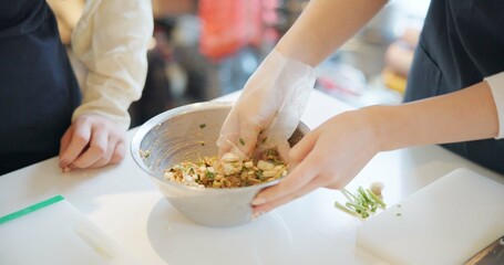 Chef hands, cooking and food in restaurant with bowl, vegetables and prepare ingredients for nutrition. People, working and catering service for diet at cafeteria with meal, dinner or lunch on table