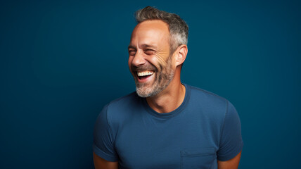 Happy smiling middle aged adult man on a solid background