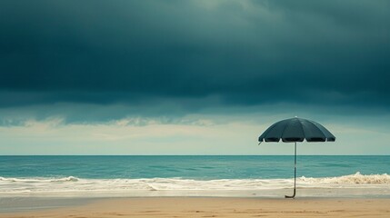 Fototapeta na wymiar sinister umbrella at the beach 