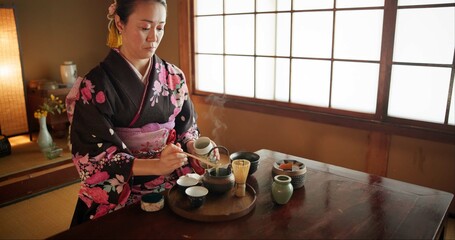 Japanese, woman and kimono for tea ceremony in Chashitsu room with matcha and traditional custom....