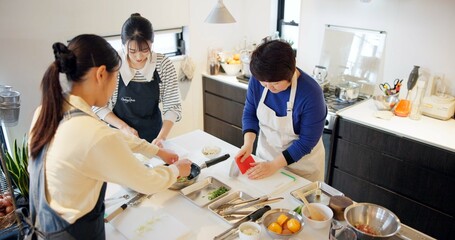 Japan, women and cooking in kitchen with preparation for food, Japanese cuisine and healthy meal in restaurant. Chef, people and traditional lunch with protein or vegetables for dinner and culture