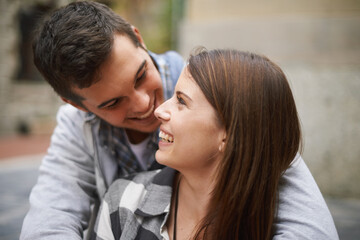 Fototapeta premium Eye contact, smile and face of couple hug, relax and enjoy date on marriage honeymoon, Valentines Day or anniversary. Trust, love bond and people happy for relationship comfort, soulmate or devotion