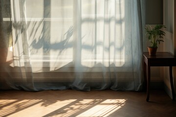 A picture of a window with sheer curtains and a plant on a table. Suitable for home decor or interior design projects