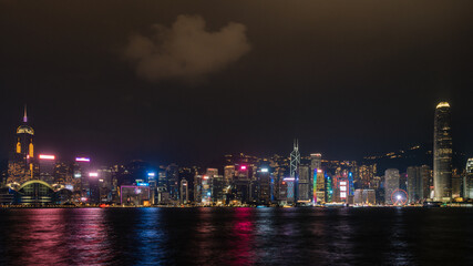 Fototapeta na wymiar Panorama of Hong Kong City skyline with tourist at night. View from across Victoria Harbor HongKong.