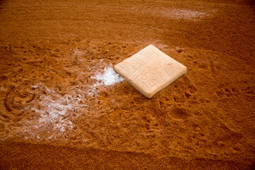 red clay baseball field and various views of the baseball home plate