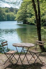 Fototapeta premium vintage garden table, lake and trees in the background