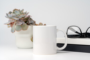 Coffee mug on white office table mock up