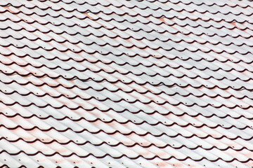 Metal tiles on the roof as an abstract background. Texture