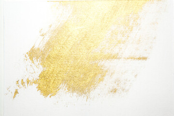 gold paint splatter on a white background
