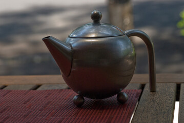 Antique metal teapot for hot tea from an Italian restaurant