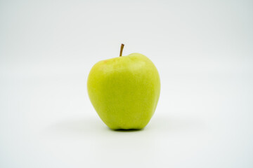 Green apple close up on white background isolated.