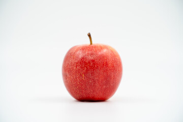 Red apple close up on white background isolated.