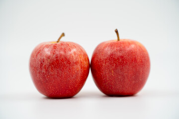 Red apples close up on white background isolated.
