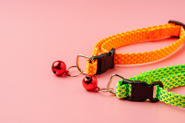 Textile pet collar on pink background studio photo
