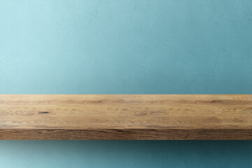 木目のあるナチュラルな木の棚(台)と青の凹凸のある壁の背景
