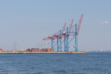 Port cargo crane and container ship in harbor of Odesa, Ukraine