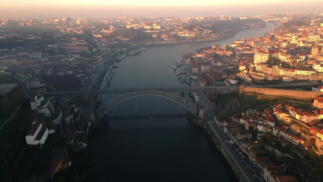 Sunrise over the city of Porto, Ponte Luis 1 bridge, and the Douro River from an aerial perspective, captured with a drone