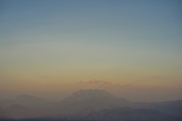 Obraz premium travel and people activity concept with twilight sky before sunset with layer of mountain