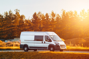 Commercial van on the road. Delivery van close-up mockup isolated. Final destination shipping truck mock-up. Door-to-door business and customers delivery.
