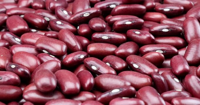 Video close up of red-brown kidney beans in rotating motion